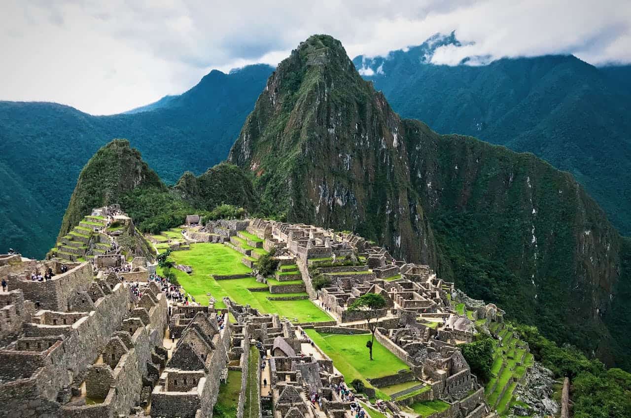 Explore the breathtaking ancient ruins of Machu Picchu set in Peru's stunning Andes mountains.